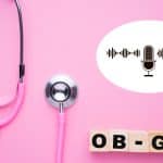 Pink background with pink stethoscope, and wooden blocks reading OB-GYN. A white cartoon speech bubble also shown with black microphone and sound waves inside.