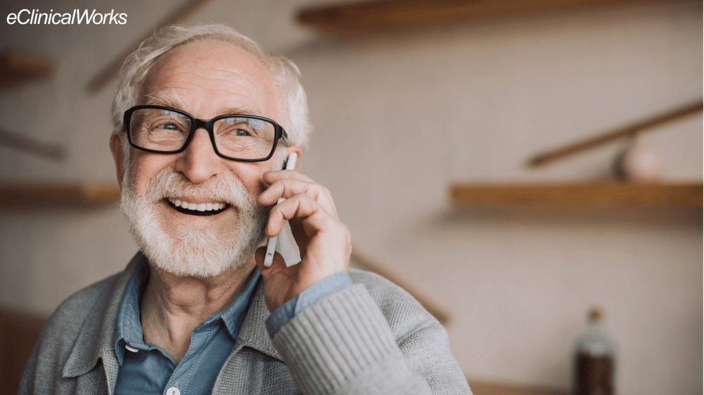 older man smiling while on the phone